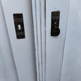 Vintage two-door wardrobe in painted white wood — late 19th century Hungarian style.