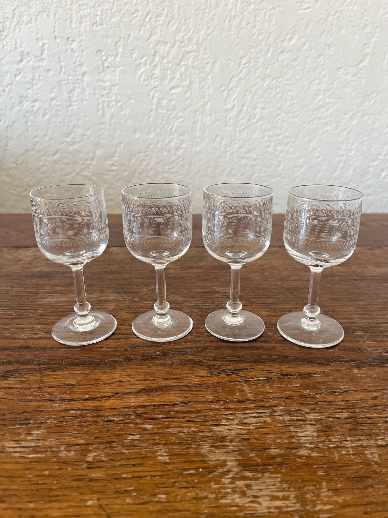 Four antique stemmed liqueur glasses in engraved crystal, 19th century