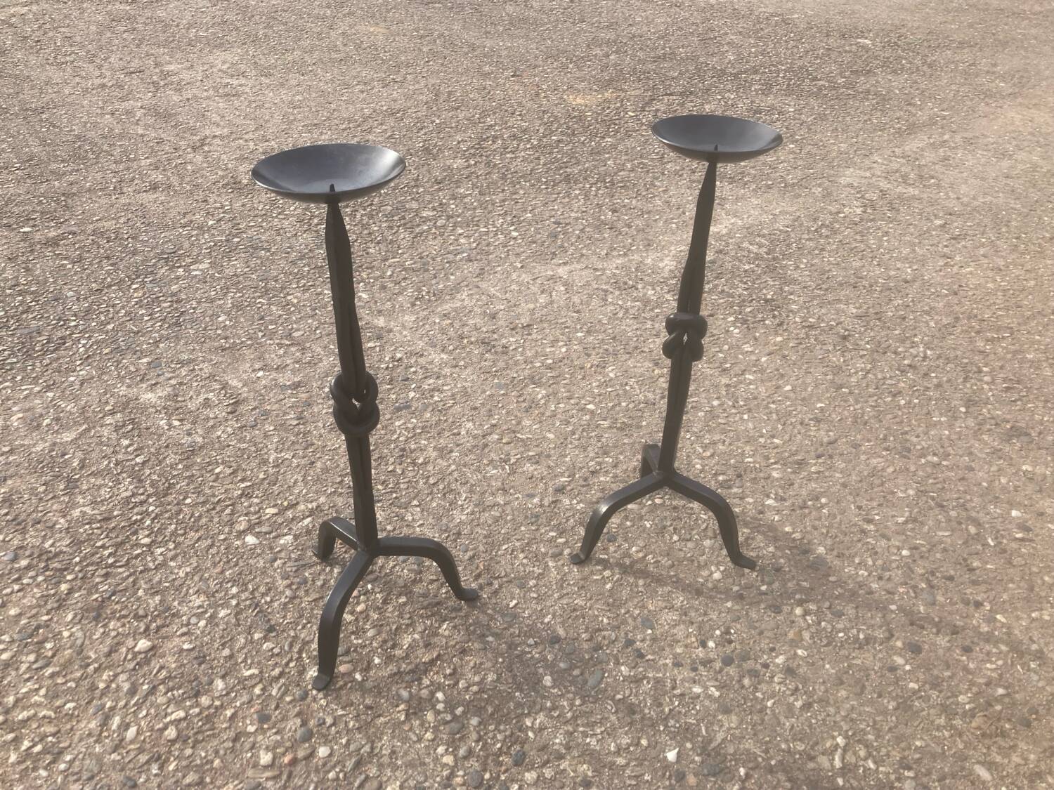Pair of wrought iron candlesticks
