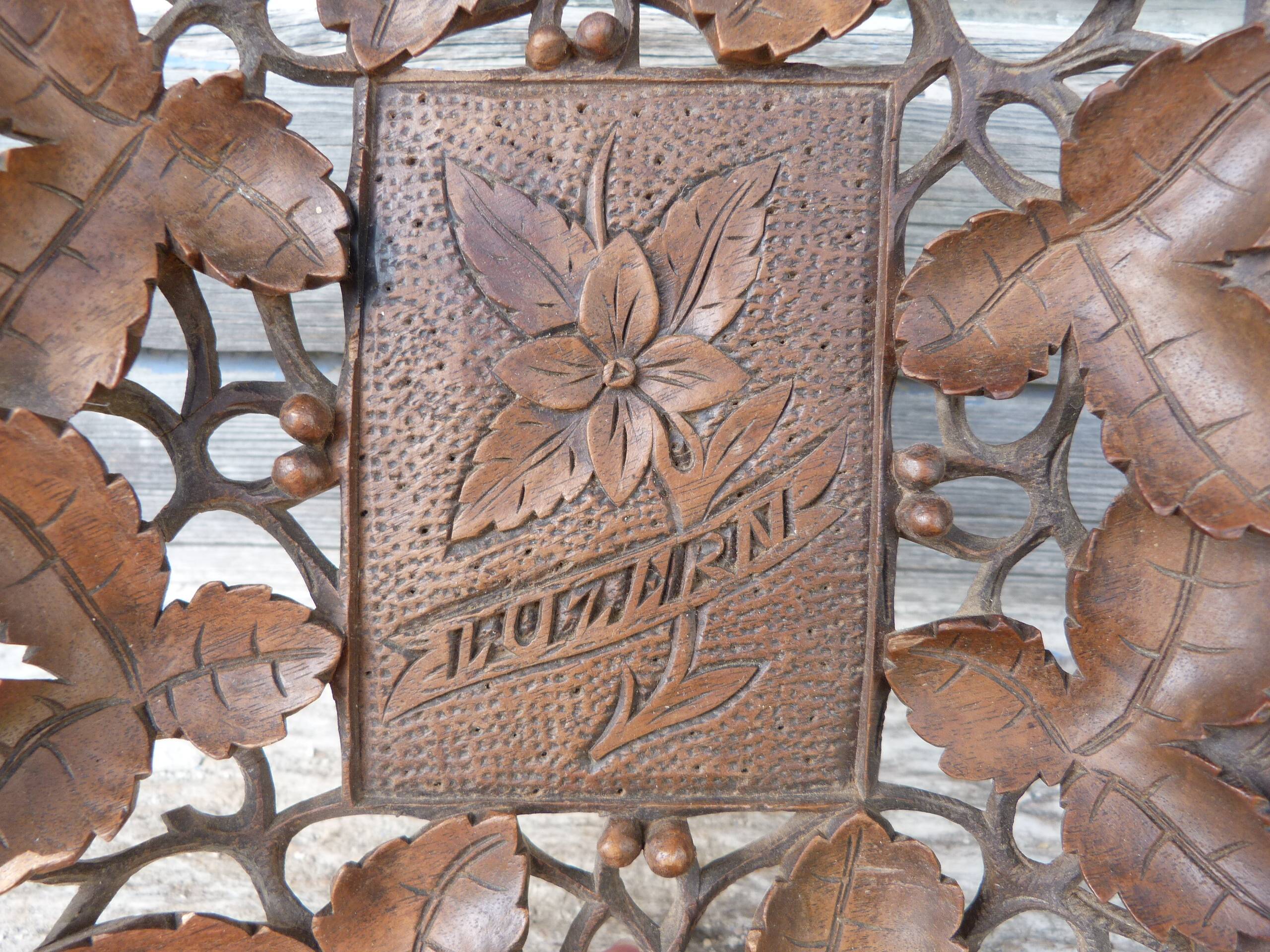 Small wooden tray cut out with leaf patterns