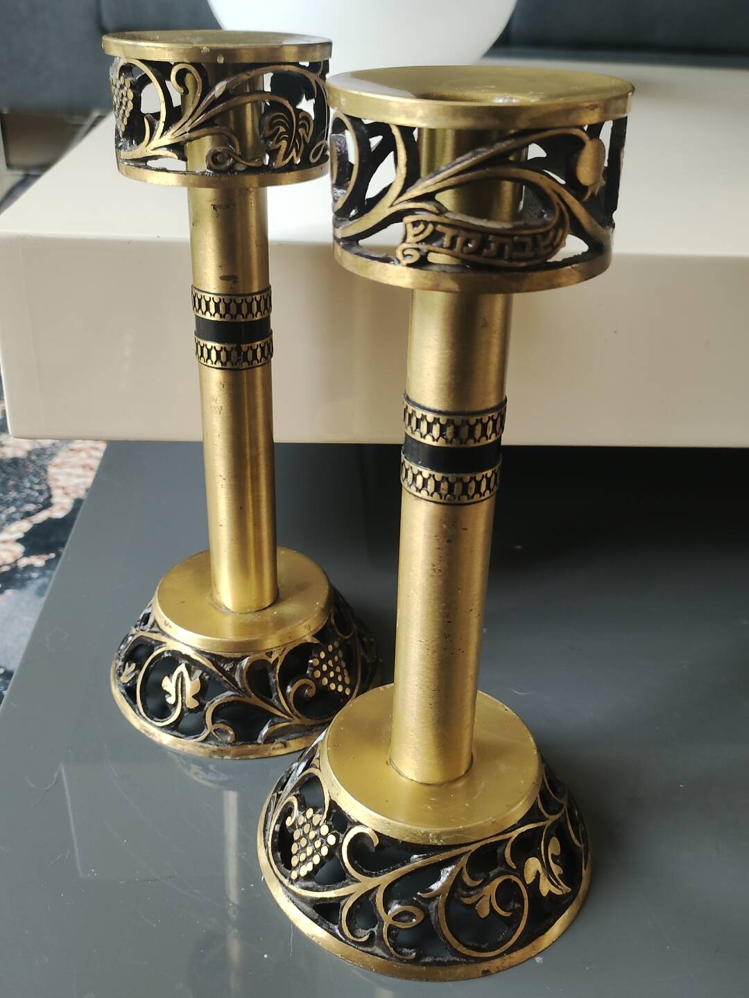 Pair of Hebrew Candlesticks. In antique gold-plated brass. Signed FFS Israel