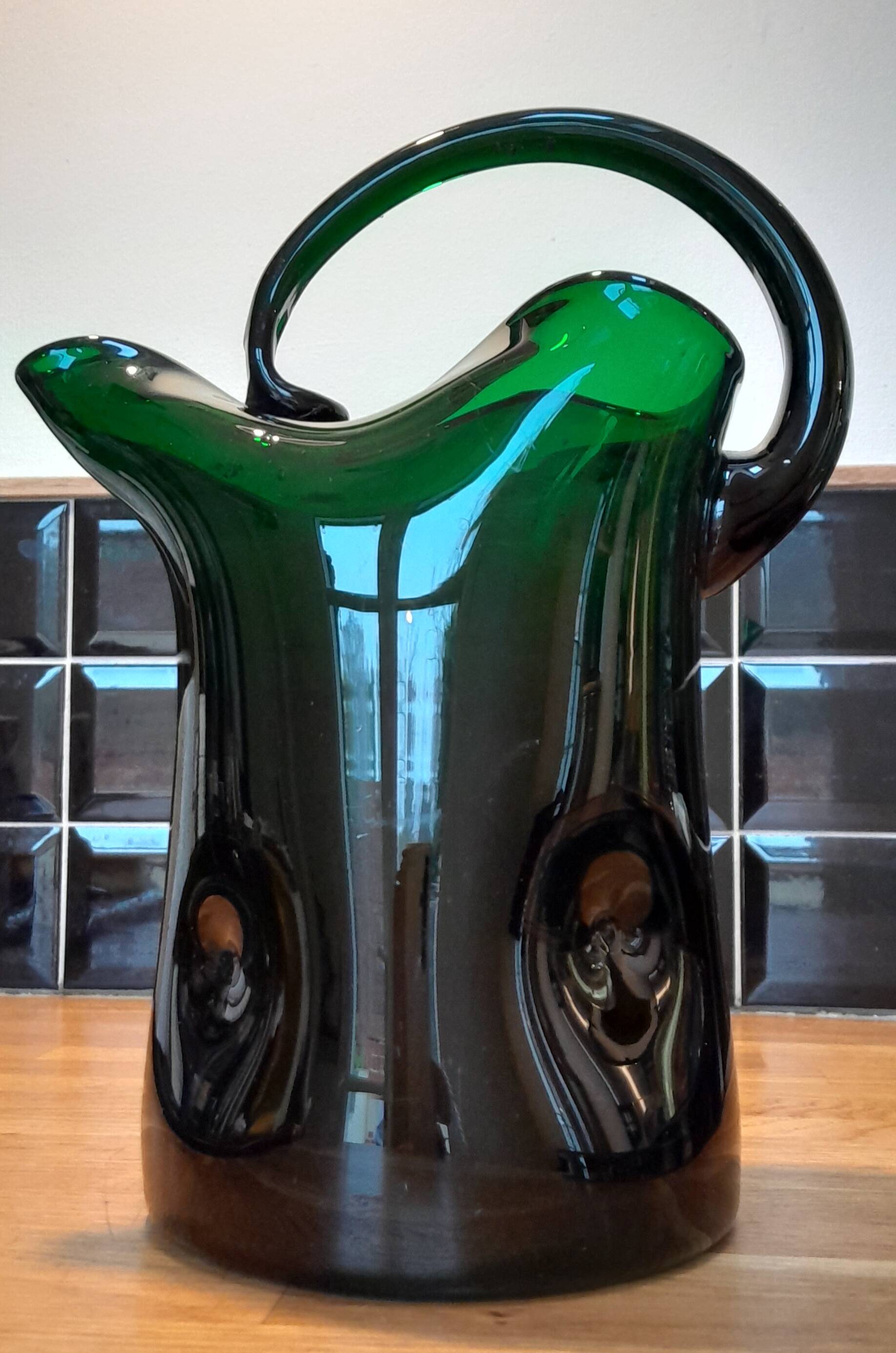 Blown glass pitcher filled