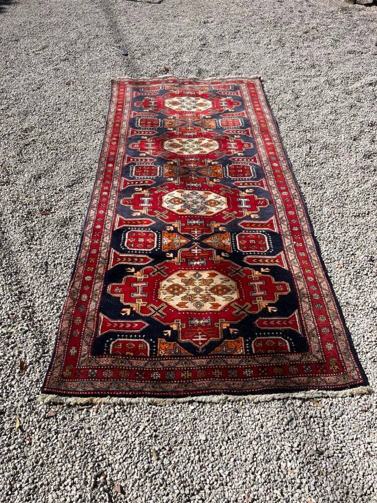 Long antique Persian carpet