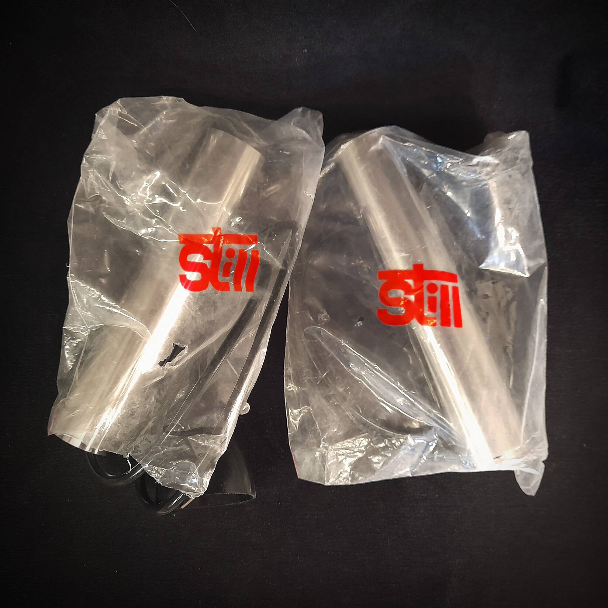 Still brand tube pendant light in polished stainless steel, 1970s, NEW