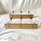 Pair of vintage wooden wall coat racks with three red ball hooks