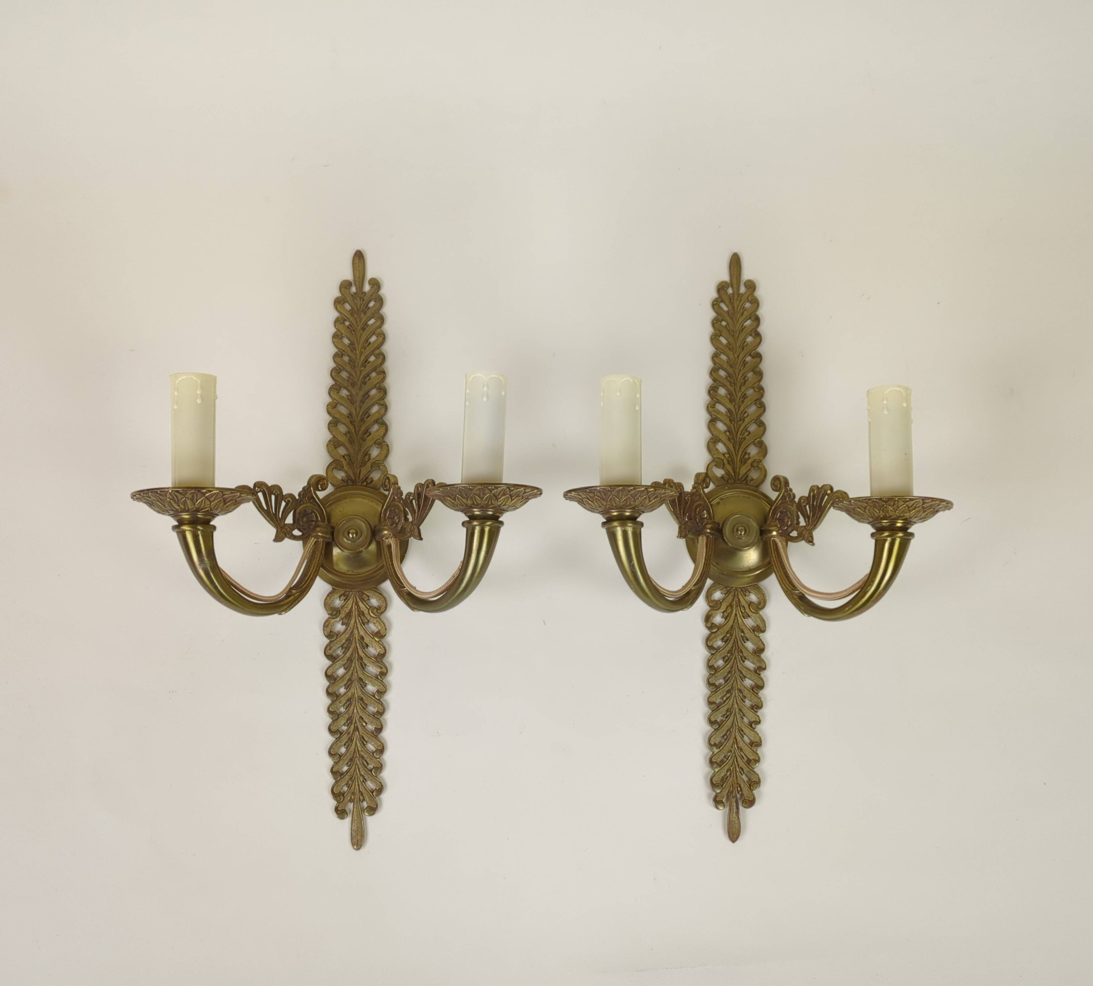 Pair of two-armed Empire wall sconces in gilded bronze