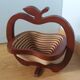 Foldable fruit basket in the shape of an apple.