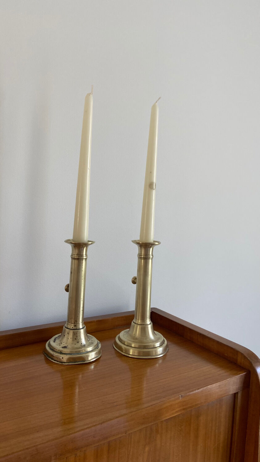 Pair of antique brass push candlesticks