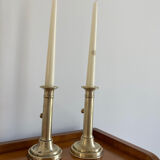 Pair of antique brass push candlesticks
