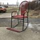 Vintage red metal rocking chair, graphic plastic cord with fan backrest, 1960s.
