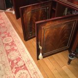 A mahogany buffet varnished with marble and bronze
