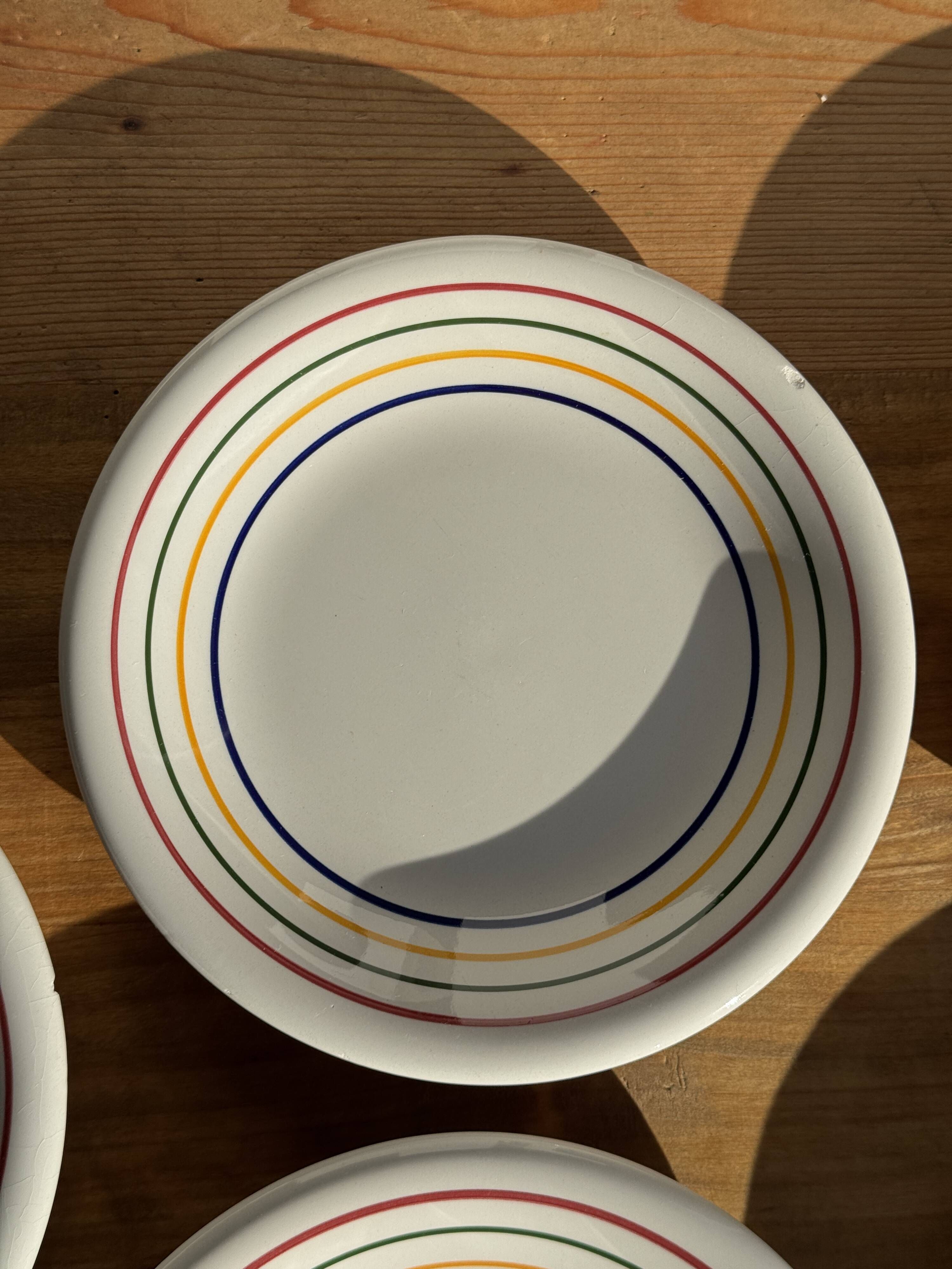 Set of 9 small Italian dessert plates Primula with red and green trim.