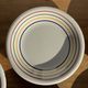 Set of 9 small Italian dessert plates Primula with red and green trim.