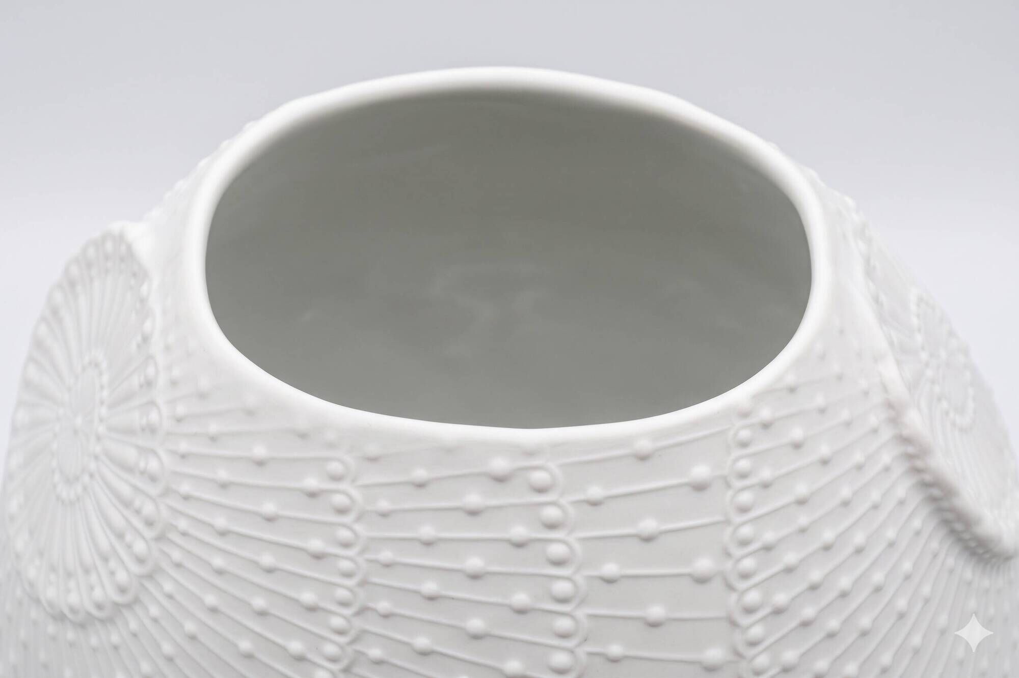 Biscuit porcelain vase by Kaiser, relief decoration, op art design.