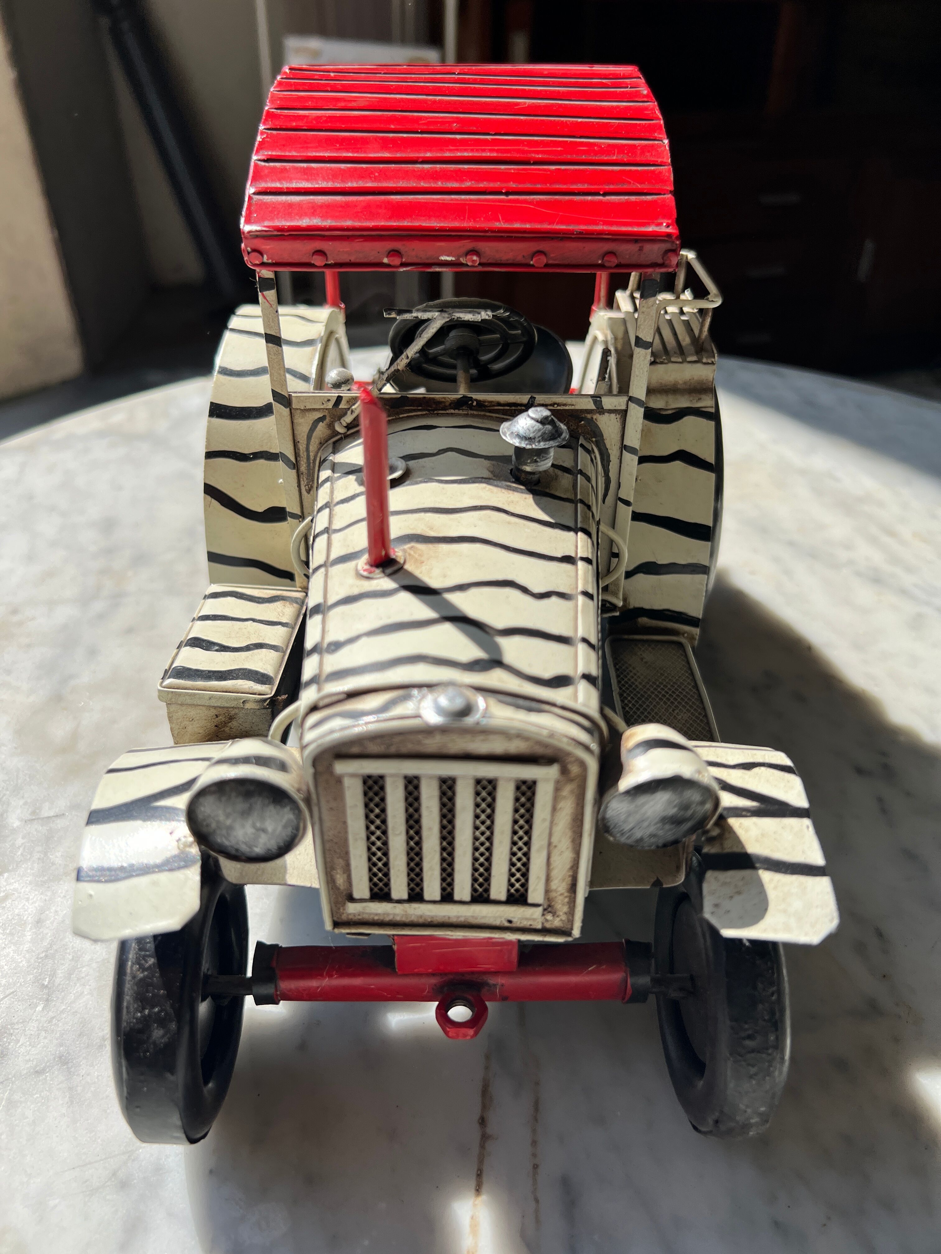 Old zebra metal tractor