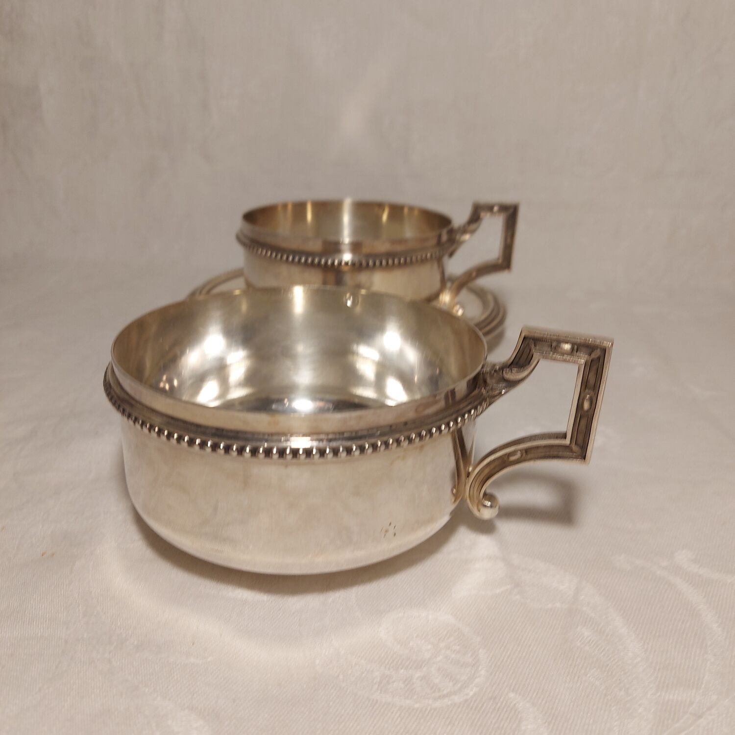 Duo of chocolate cups in silver metal