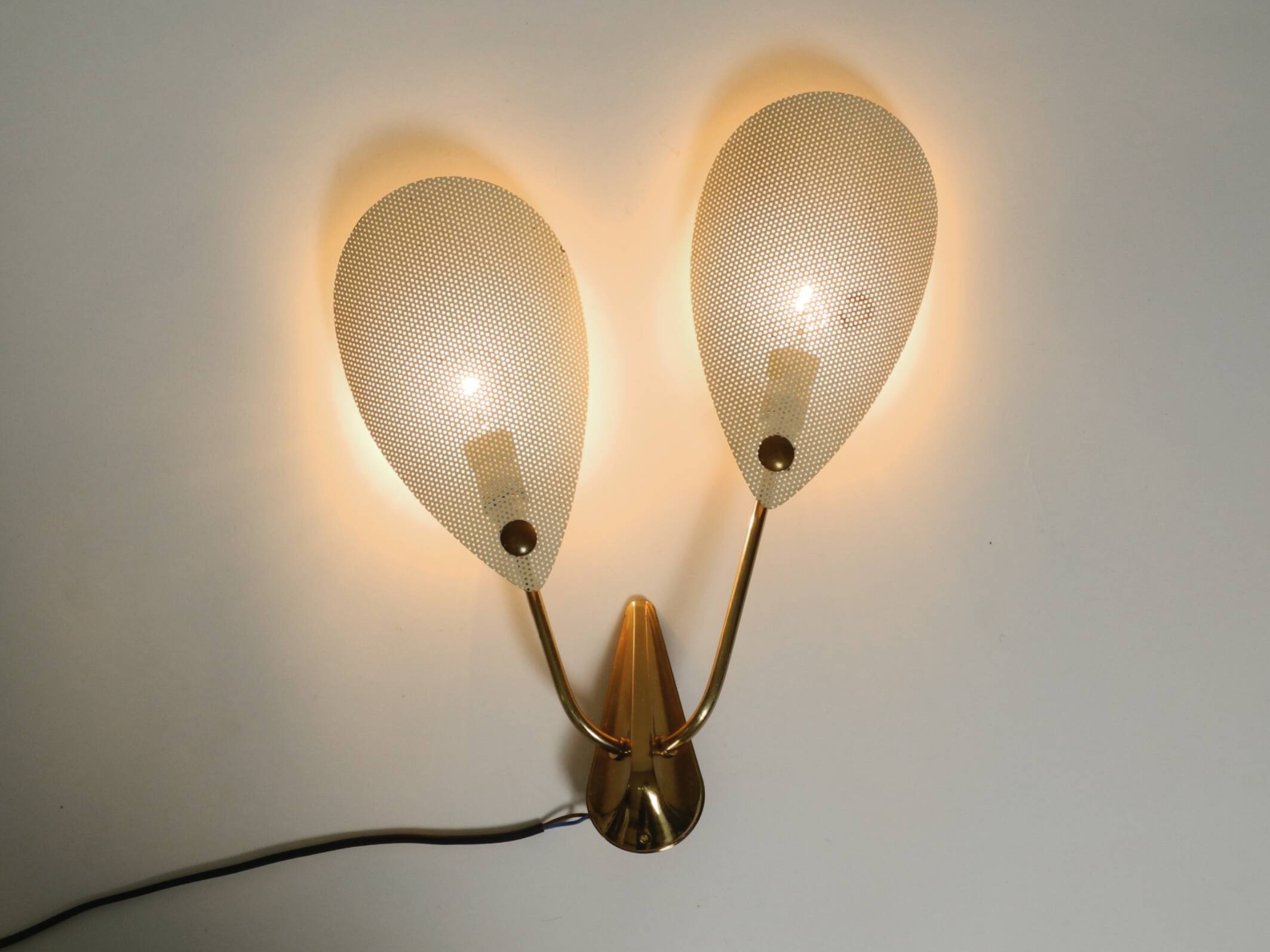 Mid Century Modern brass wall lamp with perforated metal sheet lampshades
