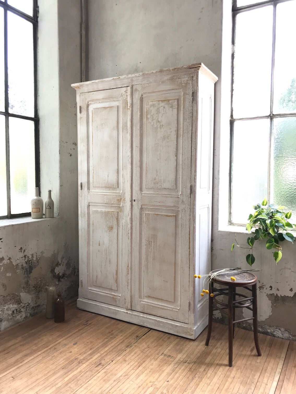 Antique wardrobe in patinated pine