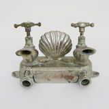Old bathtub faucet, kitchen in silvered bronze with its shell-shaped soap dish