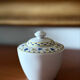 Fine porcelain sugar bowl from Bavaria with a grape design.