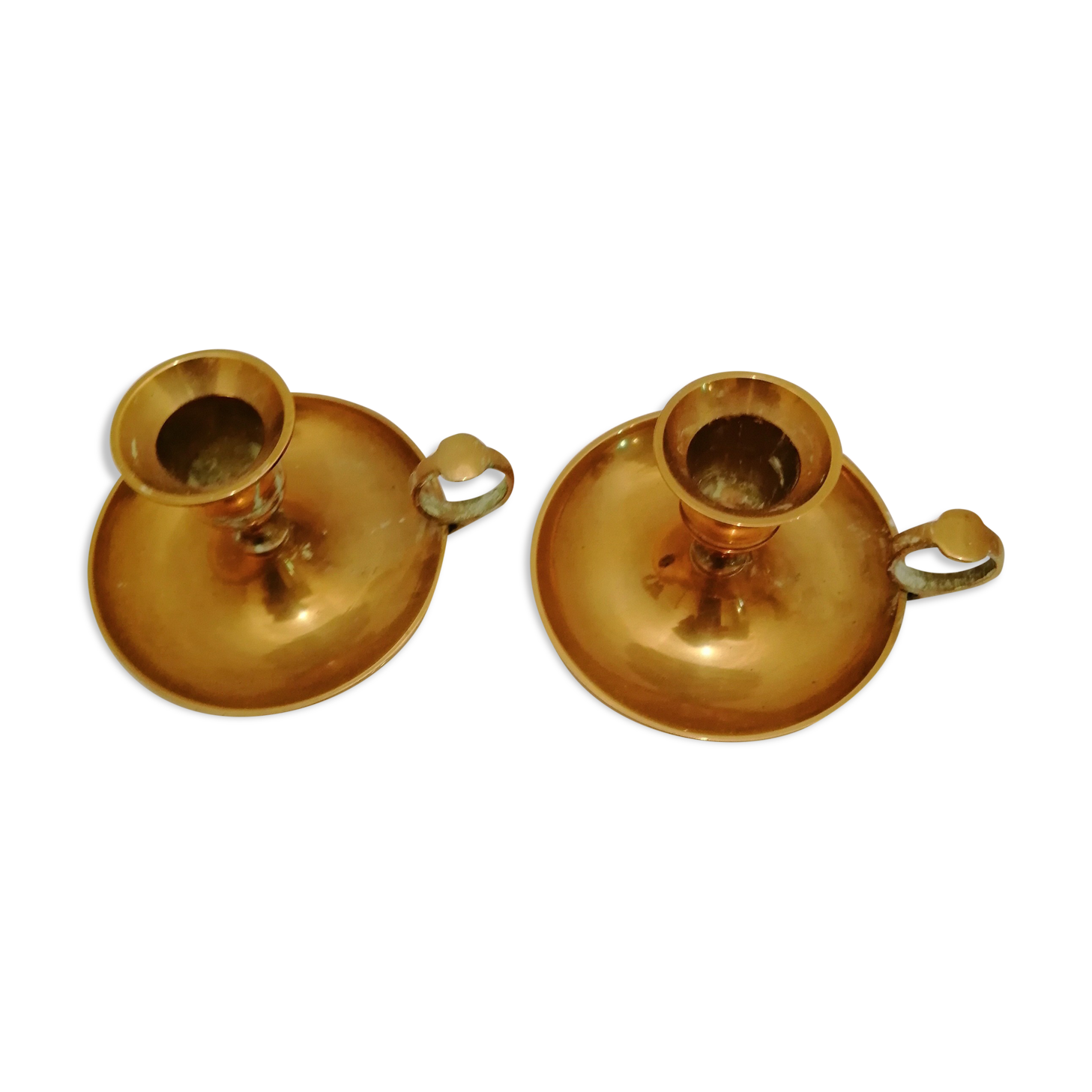 A PAIR OF SMALL COPPER CANDLE HOLDERS