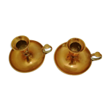 A PAIR OF SMALL COPPER CANDLE HOLDERS