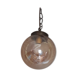 Vintage globe suspension in amber glass, chiseled floral decoration - 80s
