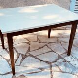 Vintage oak farmhouse table with a white top.