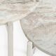 Round tables, side tables, coffee tables in marble and steel.