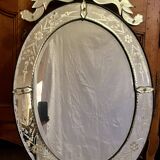 Oval Venetian mirror with close-bezel, early 20th century, flower decoration
