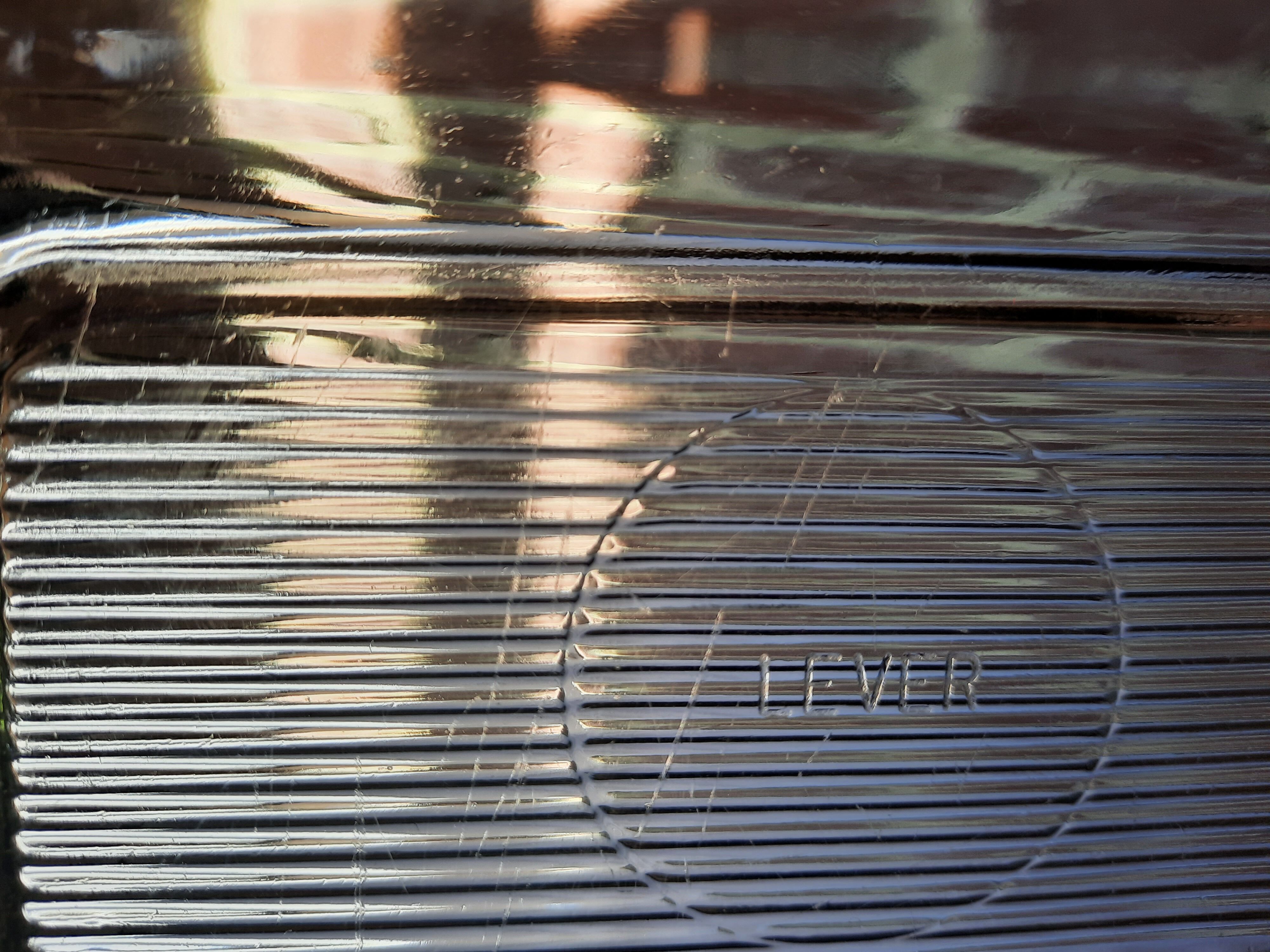 Transparent glass butter dish from lever