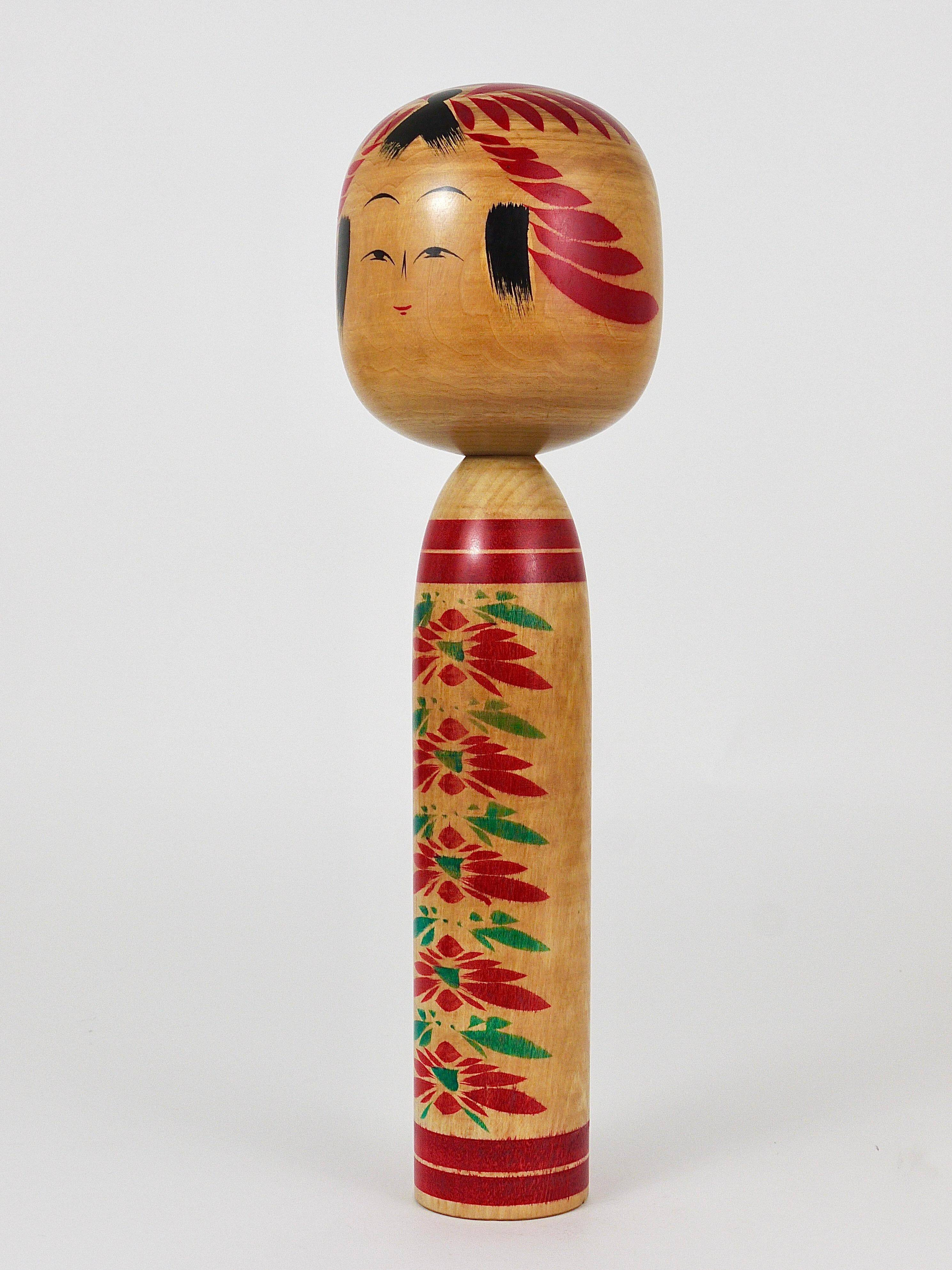 Decorative Togatta Kokeshi doll sculpture from northern Japan, hand-painted.
