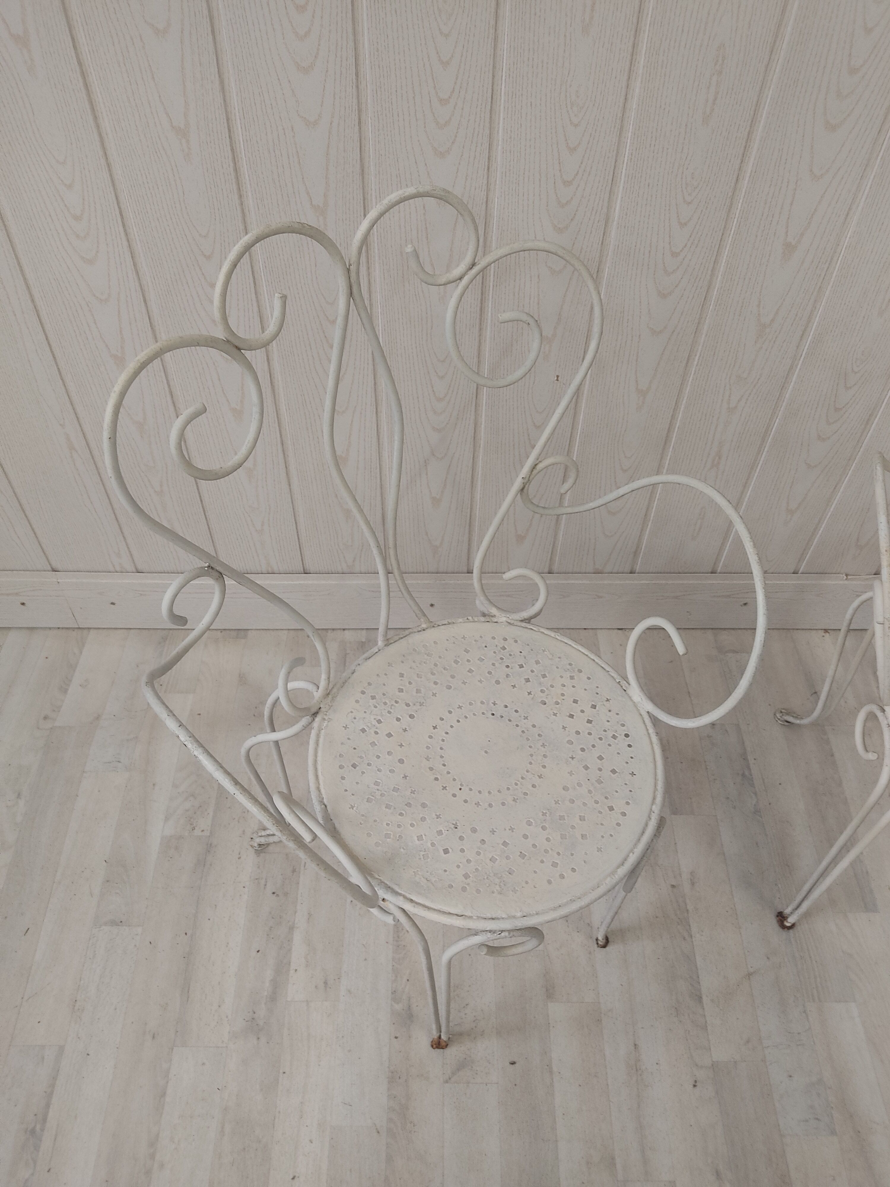Pair of wrought iron garden chairs