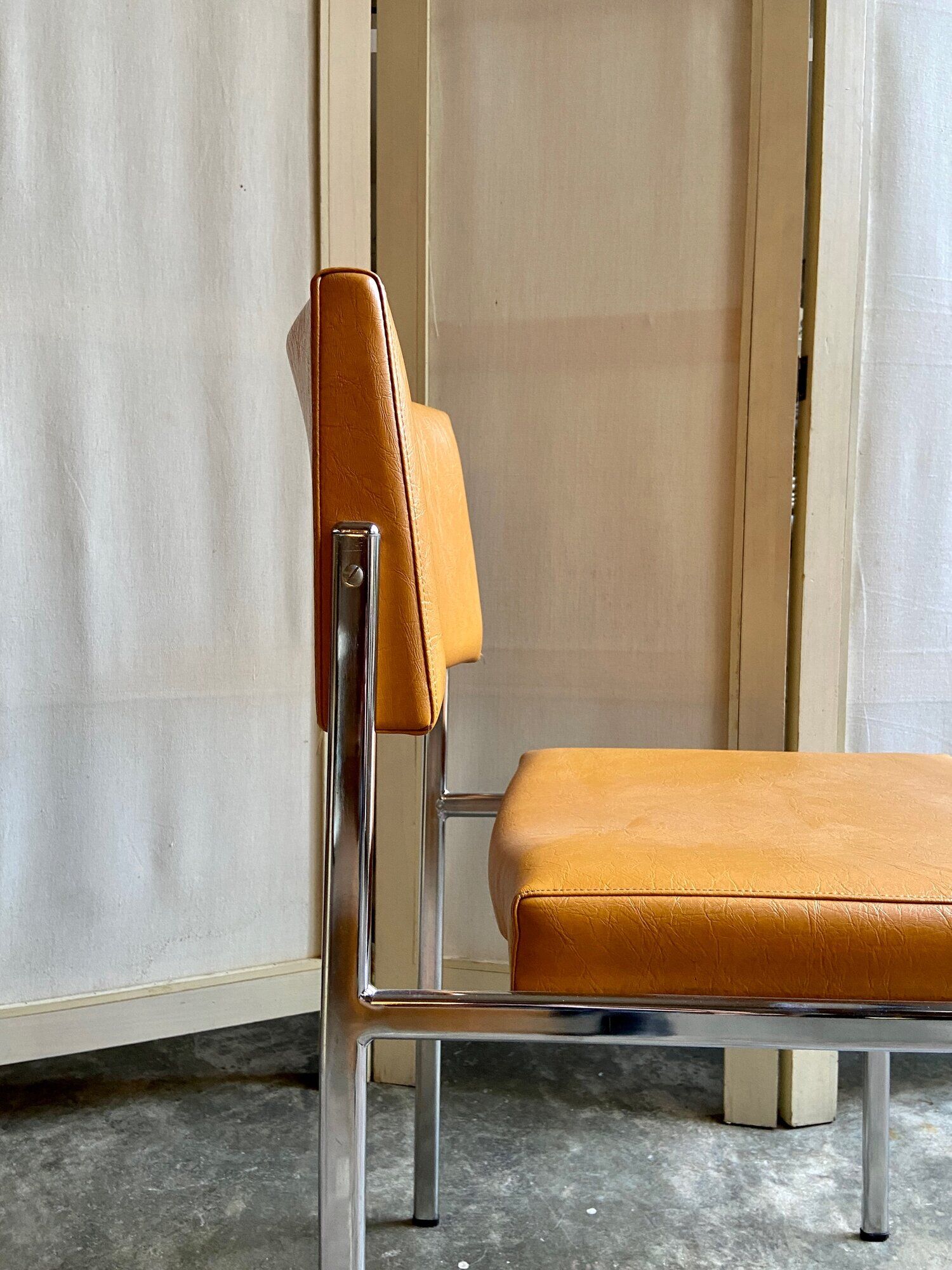 Chair in chromed metal and ochre skaï 1970s