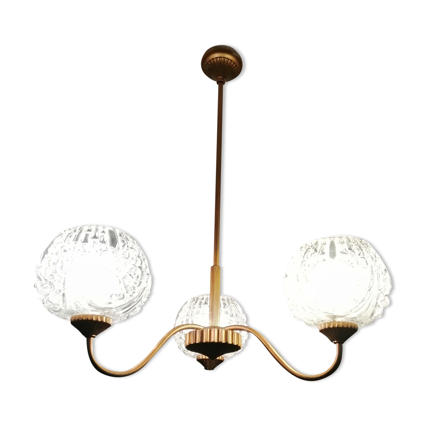 antique chandelier has 3 globes