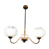 antique chandelier has 3 globes