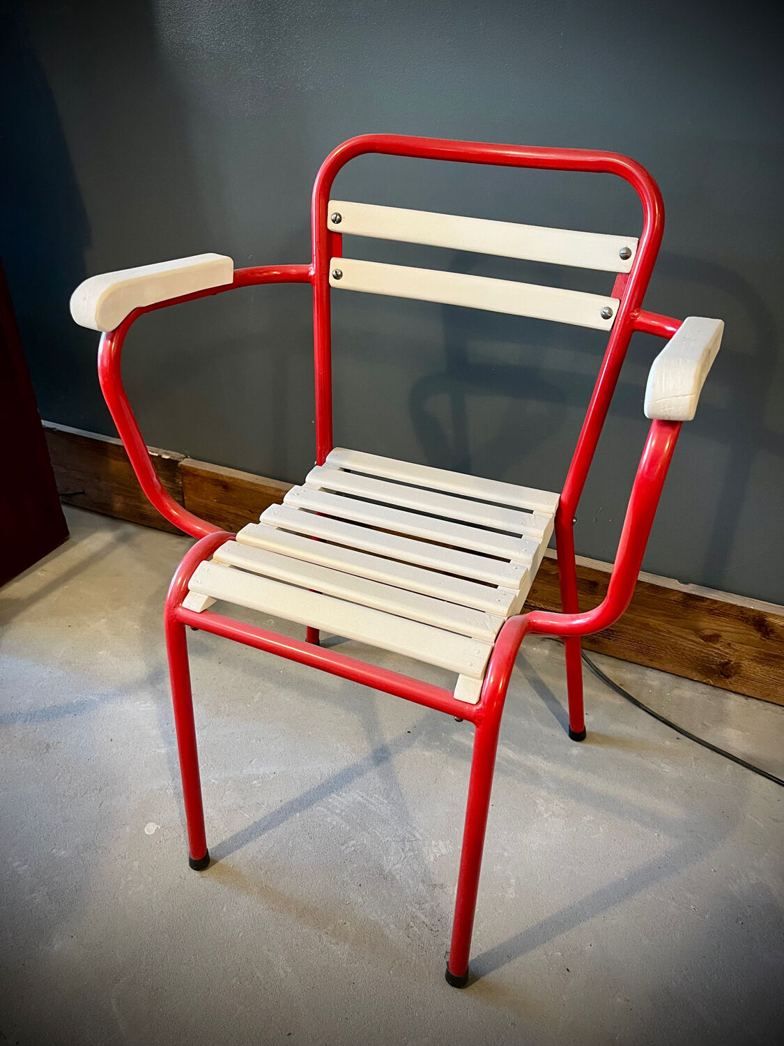 Four TOLIX chairs with armrests