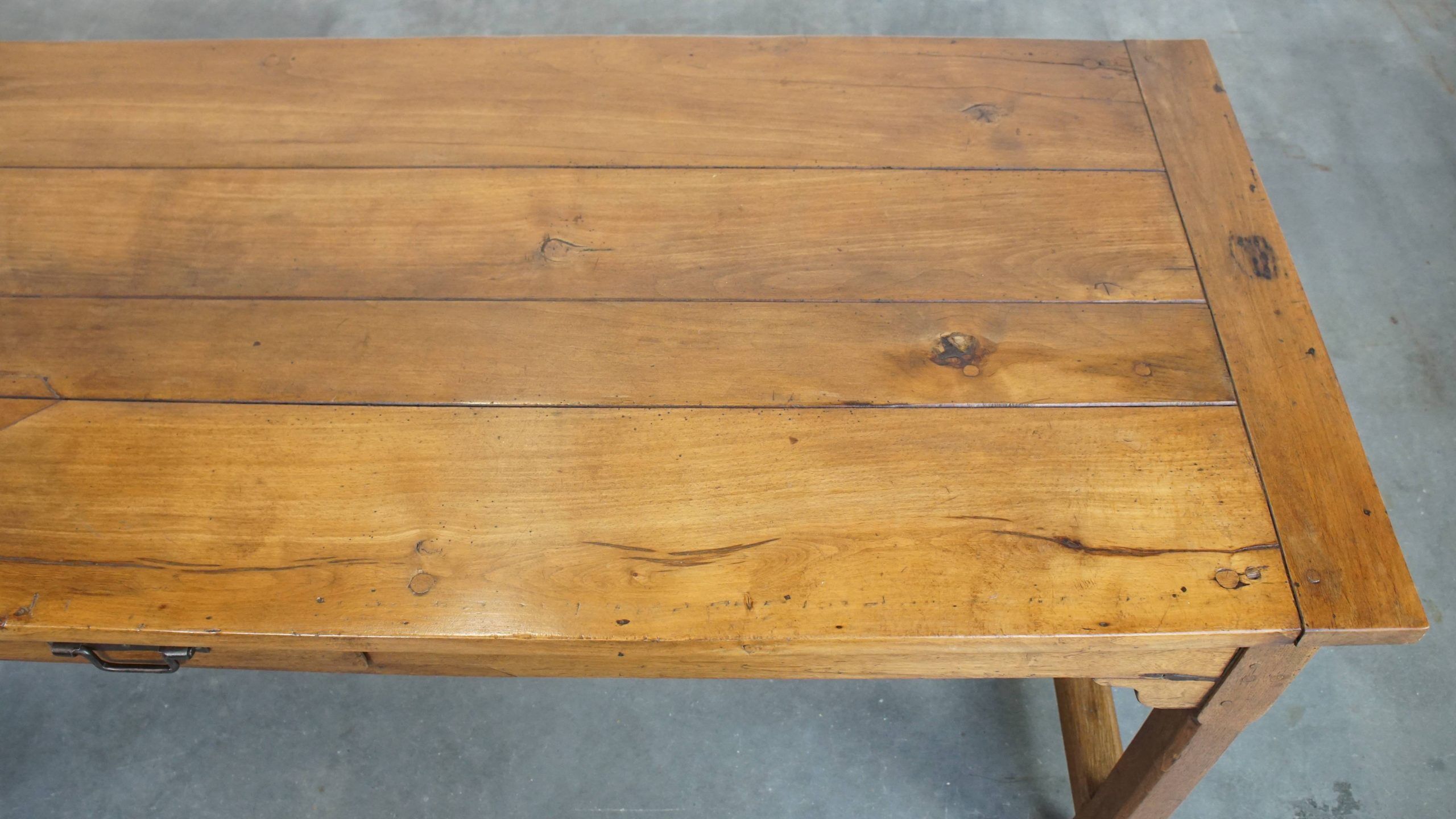 Antique French farmhouse dining table of fruitwood from the 18th century