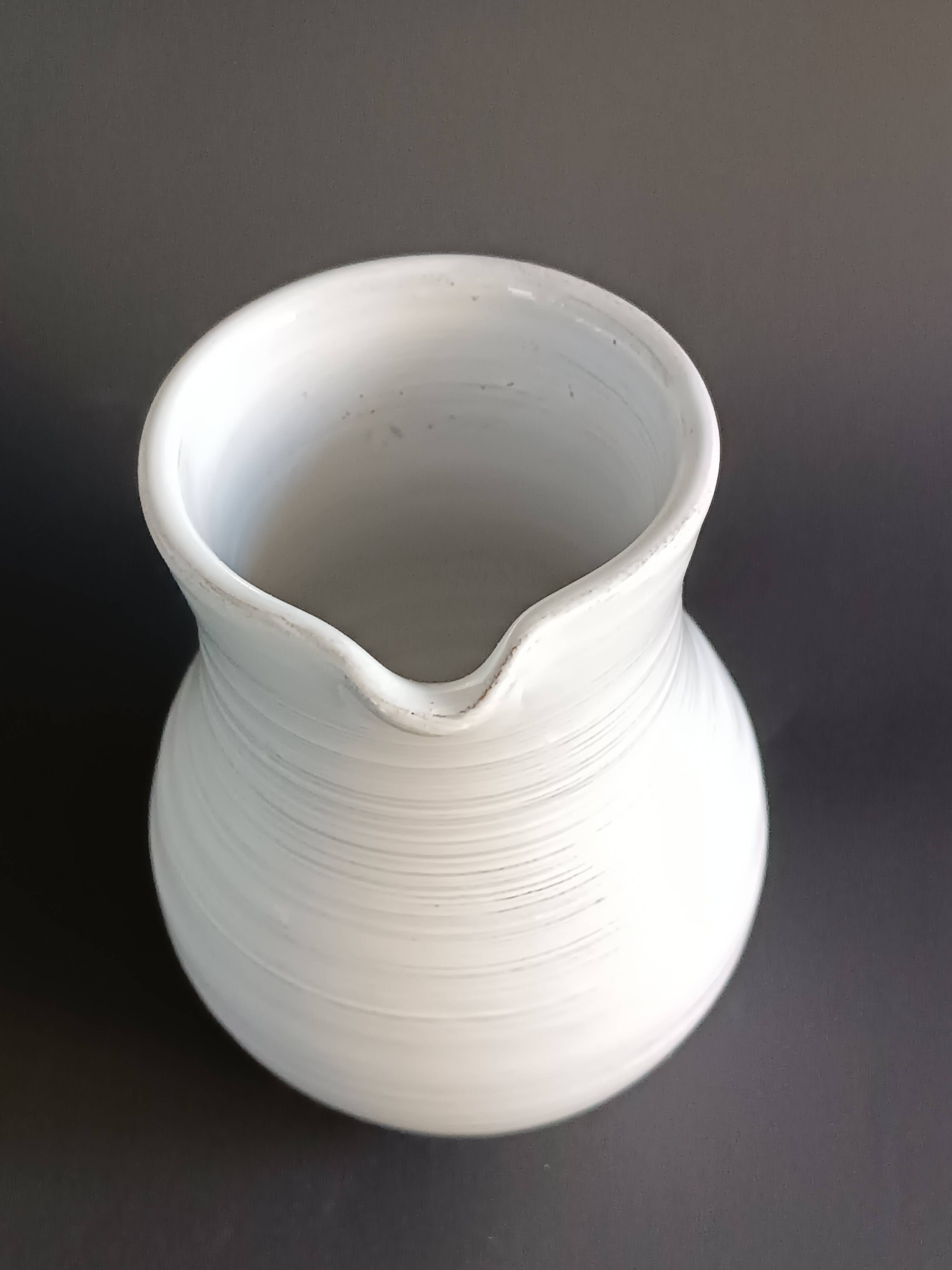 Vintage white glazed ceramic pitcher signed