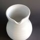 Vintage white glazed ceramic pitcher signed