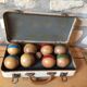 Old set of wooden balls in his suitcase