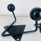 Pair of wall hooks from the 1950s, black metal