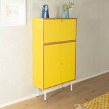 Classic sideboard from the 1960s, oak veneer, yellow Resopal, white steel feet