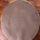 Oval brass mirror