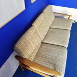 Scandinavian sofa in wood and vintage fabric from the 60s