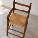 High chair made of straw and wood
