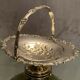 Cut basket basket handle on pedestal in silver metal with floral decoration