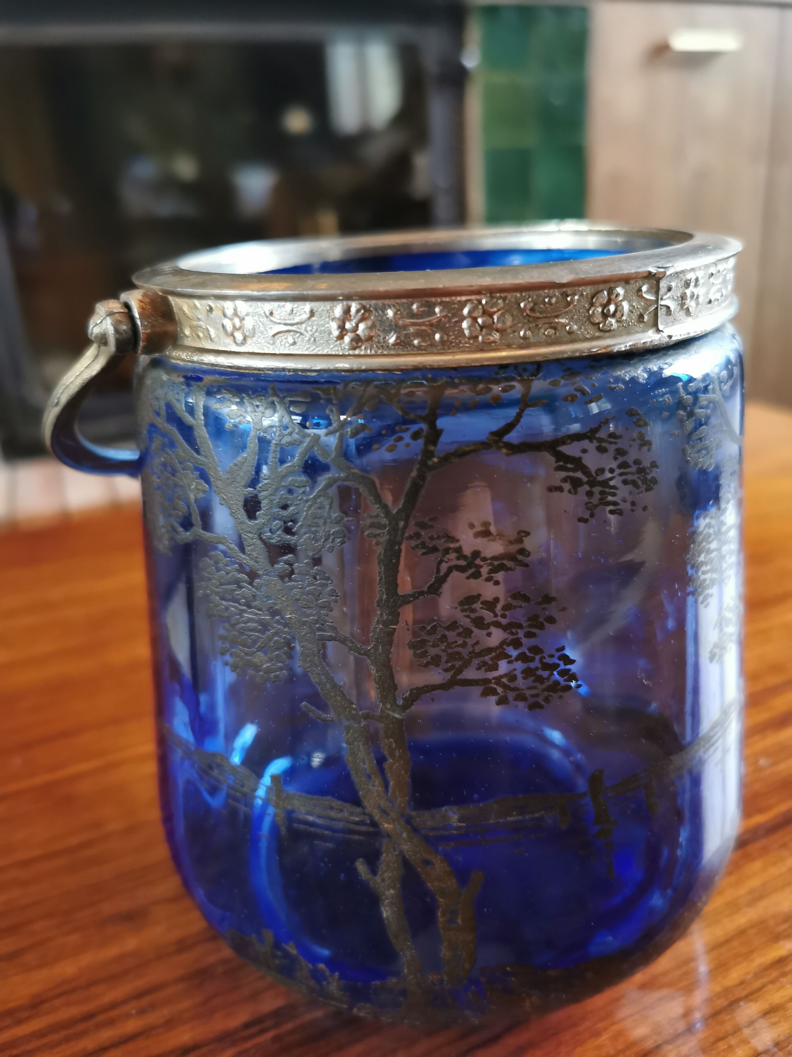Old ice or biscuit bucket made of golden decor blue glass