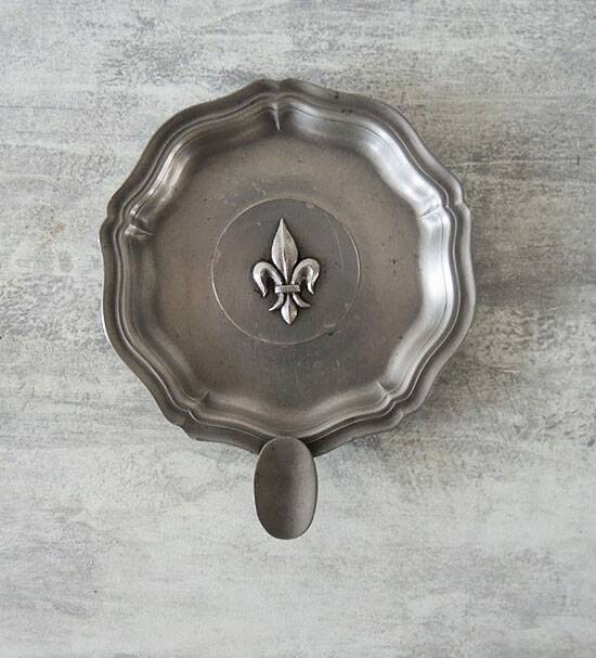 Old fleur de lys ashtray in pewter
