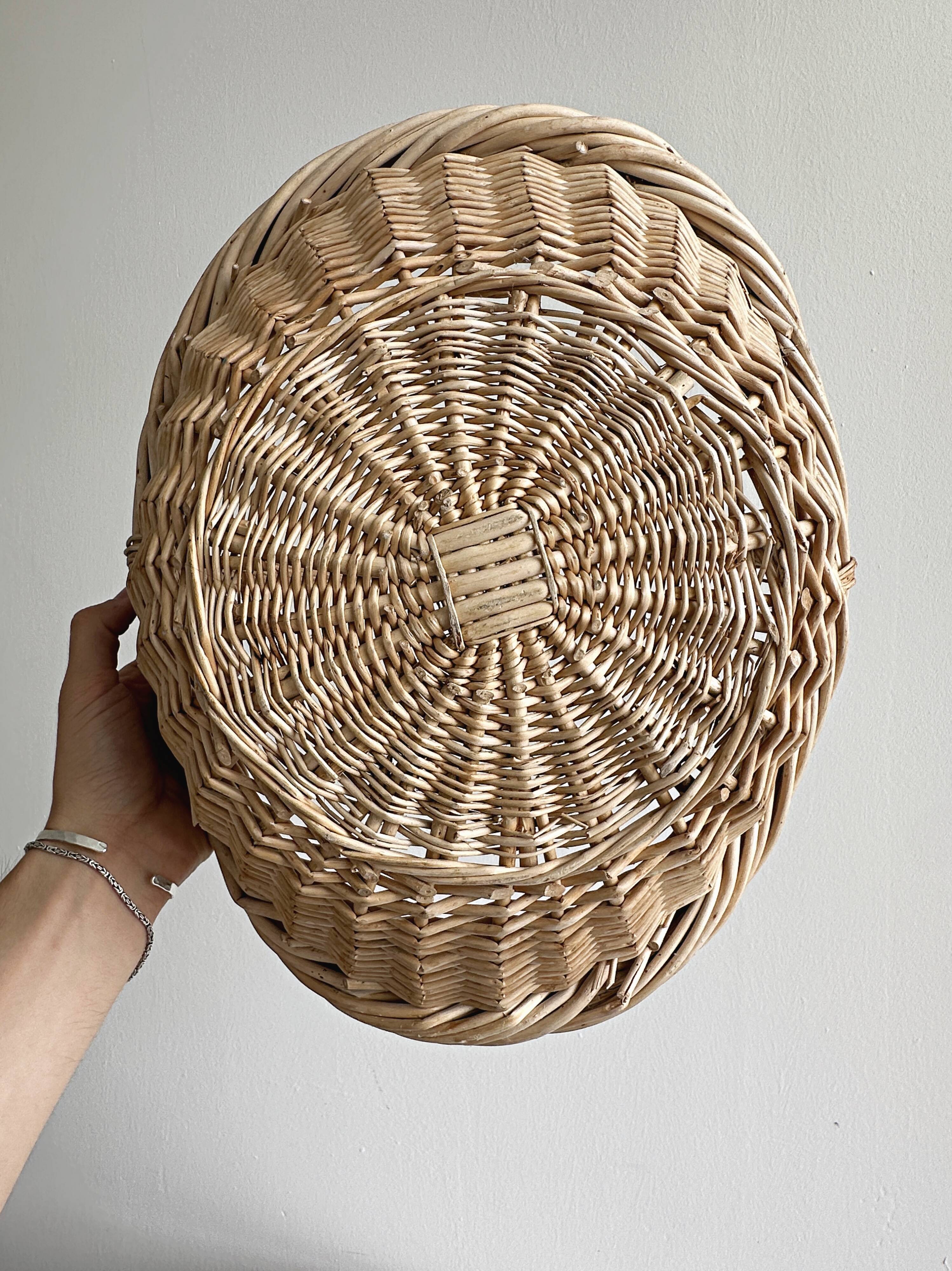 Large antique woven wicker basket with handle.